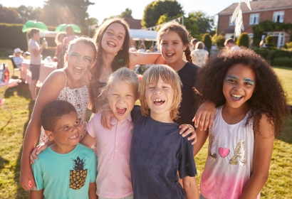 Children outside smiling